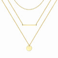 18K gold plated steel necklace with three layered chains featuring a disc pendant and bar charm. Waterproof and hypoallergenic jewelry piece.