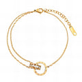 Waterproof gold anklet with dual chain design and Roman numeral charm, adjustable 20 + 5 cm for daily elegance and hypoallergenic wear.